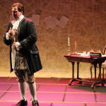 Colour photograph of Jonathan Forbes Kennedy, baritone, on stage in costume as 'The Poet' during a Royal Conservatoire of Scotland production of the Salieri's Prima la musica e poi la parole (photo credit: Royal Conservatoire of Scotland)